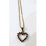 9ct gold heart-shaped pendant inset with sapphires,