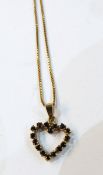 9ct gold heart-shaped pendant inset with sapphires,