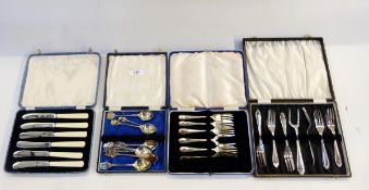 Set of six silver plated cake forks and serving fork, cased,