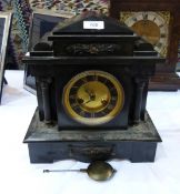 Victorian black slate mantel clock in architectural-style case, having gilt dial, striking movement,