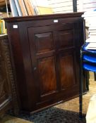 19th century mahogany corner cabinet with later restoration, panelled cupboard door,