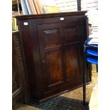 19th century mahogany corner cabinet with later restoration, panelled cupboard door,