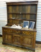 Georgian oak dresser the three tier plate rack with with moulded pediment, reeded uprights,