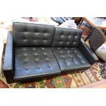 Knoll black leather and chrome two-seater settee, square-backed with button upholstery,