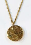 9ct gold circular locket on 9ct gold chain, the locket with engraved decoration, 23.