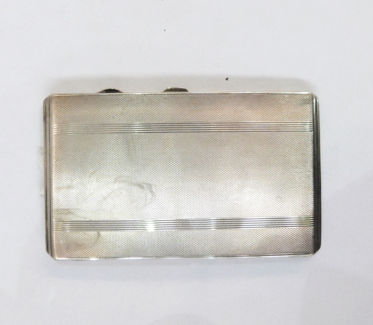 Early 20th century silver cigarette case, rectangular and engine-turned, initialled 'P.