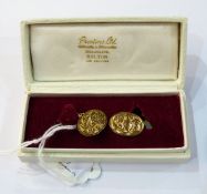 Pair of 18ct gold cufflinks, oval with scroll engraving,