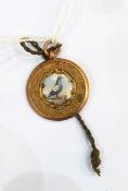 9ct gold and ceramic pigeon-racing medallion presentation pendant awarded to J Stark in 1926,