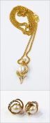 Pearl and diamond pendant set with blister pearl, in pierced scroll mount,