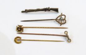 Silver bar brooch modelled as a rifle, a stickpin set with two opal cabochons and two seedpearls,