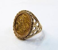 1982 sovereign mounted in a 9ct gold ring, with heart-shaped decoration to sides of shank,