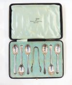 Set of six George V silver teaspoons and matching sugar nips, Old English pattern, cased,