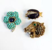 Vintage Hattie Carnegie tiger brooch set with diamante and having green eye and enamelled stripes