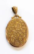 Gold coloured metal pendant with scroll engraved decoration