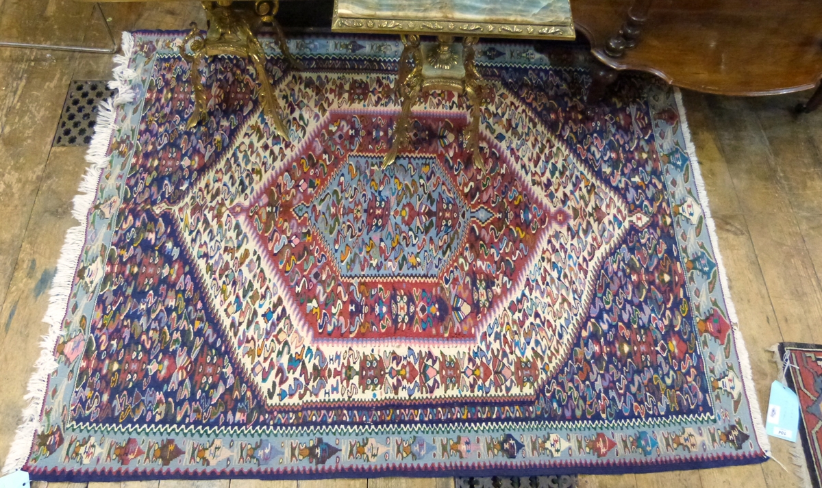 Senneh Kelim rug with multiple bordered hexagonal arabesque to centre,