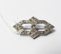 Art Deco diamond and platinum lozenge-shaped brooch, the central diamond 4mm in diameter,