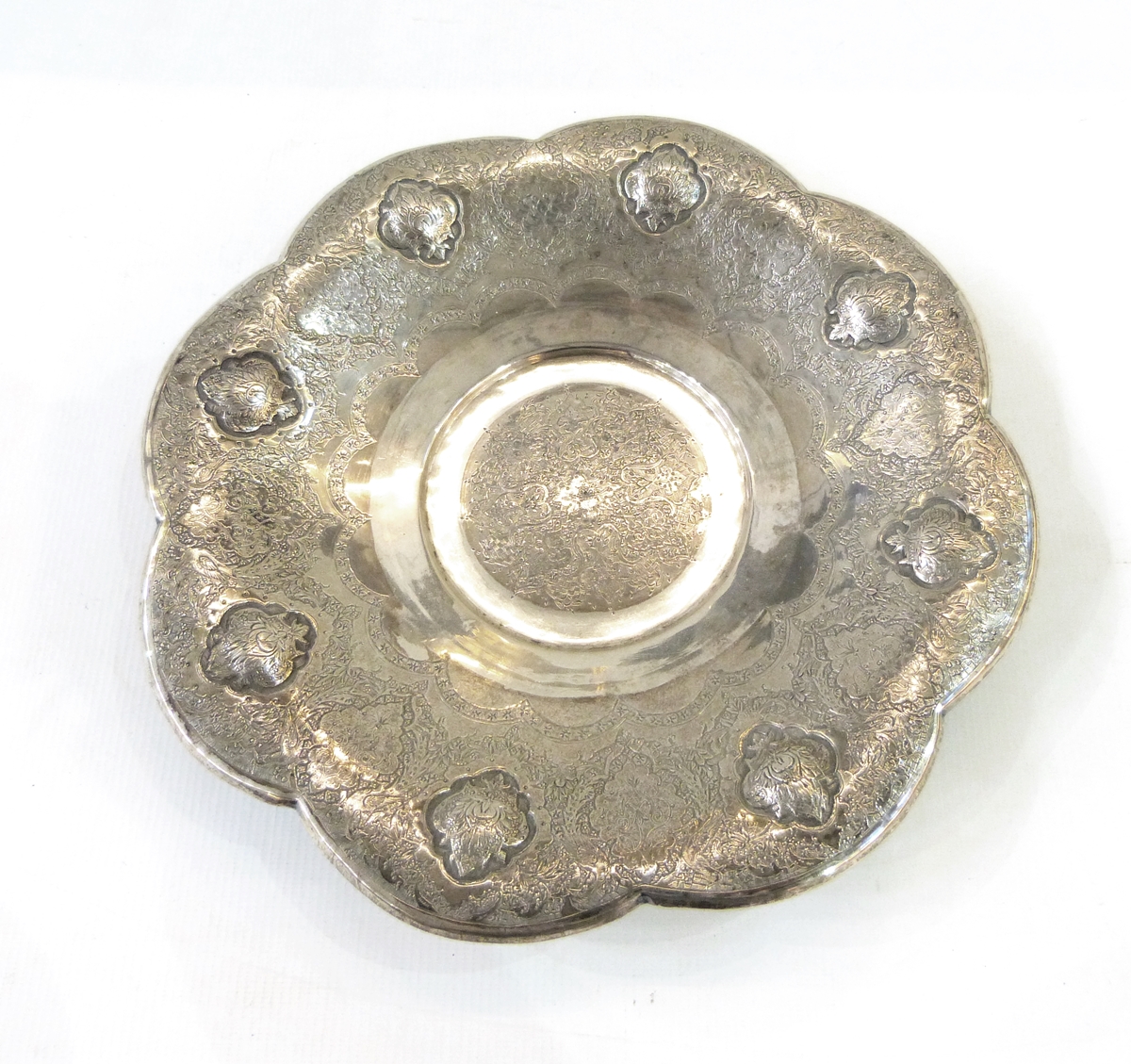 Persian white metal dish of lobed circular form,