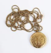 Gold-coloured metal circular locket pendant,