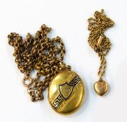 Gold-coloured heart-shaped locket with red enamel decoration, engraved to reverse,