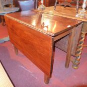 A George III mahogany dining table having twin rectangular door flaps on pad foot supports,