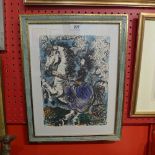 A Picasso lithograph depicting a figure on a horse in a parcel gilt frame