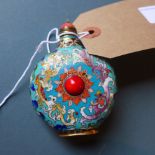 A Chinese cloisonne snuff bottle having a turquoise ground,