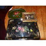 Three toleware trays having hand painted floral designs