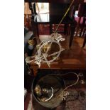 A collection of antique brass hanging lights and a large brass pan