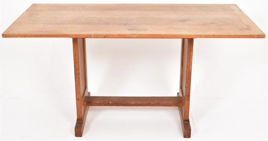 An early 20th Century oak trestle style table
