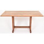 An early 20th Century oak trestle style table