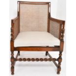 An Edwardian Cane Mahogany Armchair