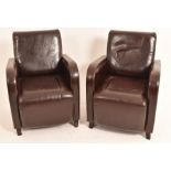 A Pair of Leather Arm Chairs