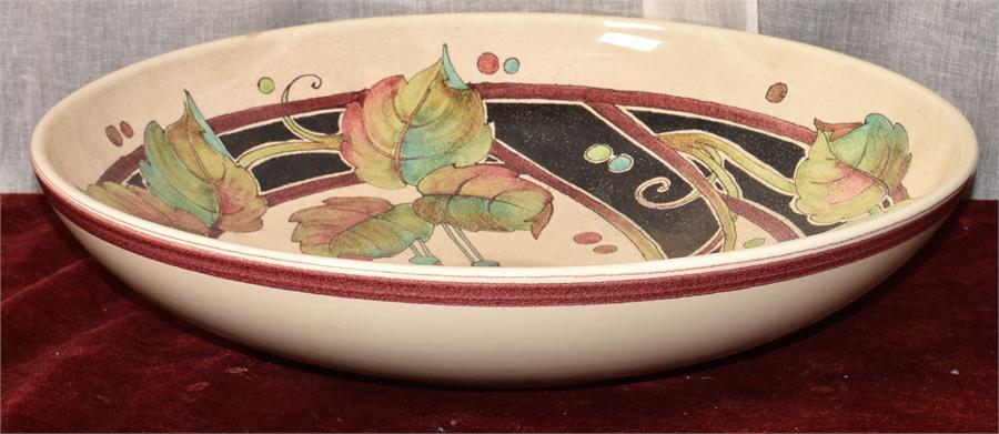 A Large Dish With Floral and Leaf Design