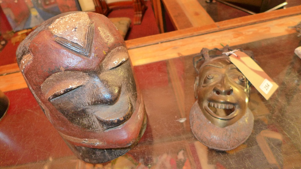 A Benin style bronze mask and an African
