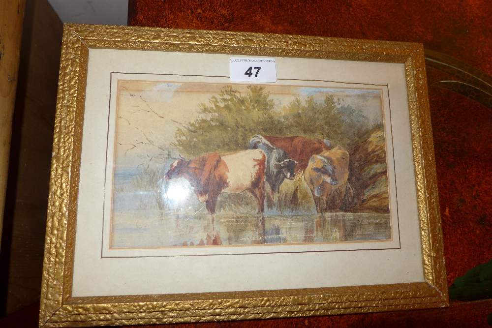 An early 20th century watercolour of cattle drinking at a riverbank, glazed and framed