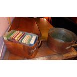 Three vintage copper preserve pans and a collection of old books