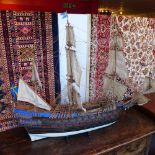 A hand painted model of an 18th century warship on stand