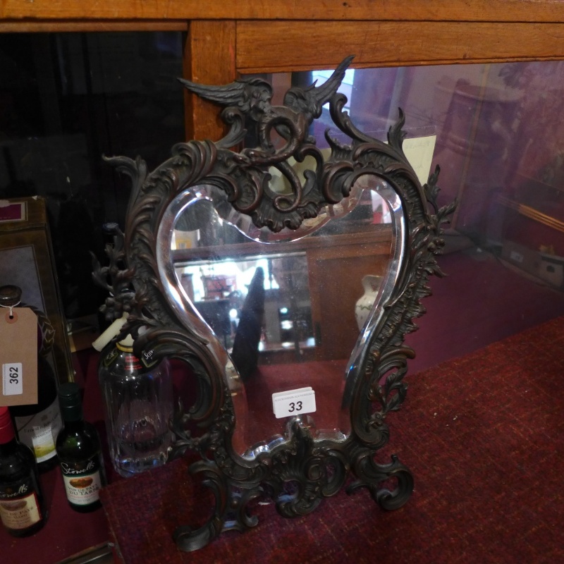 A Florentine style wall mirror with bevelled cartouche plate and ornate scrolling frame with griffin - Image 2 of 2