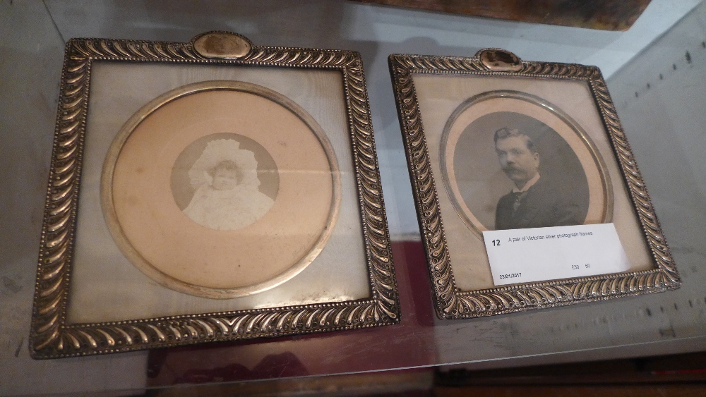 A pair of Victorian silver photograph frames