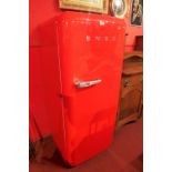 A retro style Smeg red lacquered refrigerator