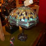 A Tiffany style table lamp with leaded coloured glass shade