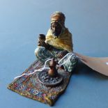 A Bergman style cold painted bronze of a Persian carpet seller