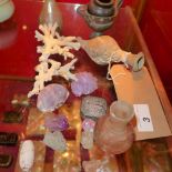 A collection of antiquity items including a small amphora, a piece of coral, amythyst stones and
