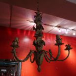 A distressed finish leafy form six branch chandelier