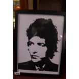 A glazed and framed art print featuring Bob Dylan