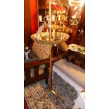 A pair of gold painted floor standing candelabras