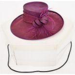 A Jeanne Petitt purple hat