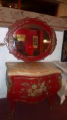 A Continental painted bombe commode chest with floral painted detail and fitted two drawers,