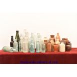 A collection of antique bottles and flas