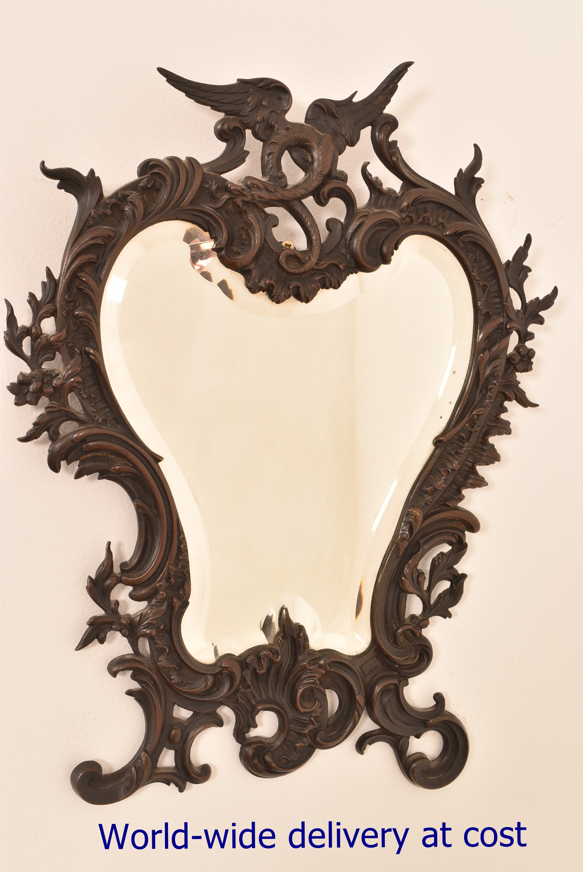 A Florentine style wall mirror with beve